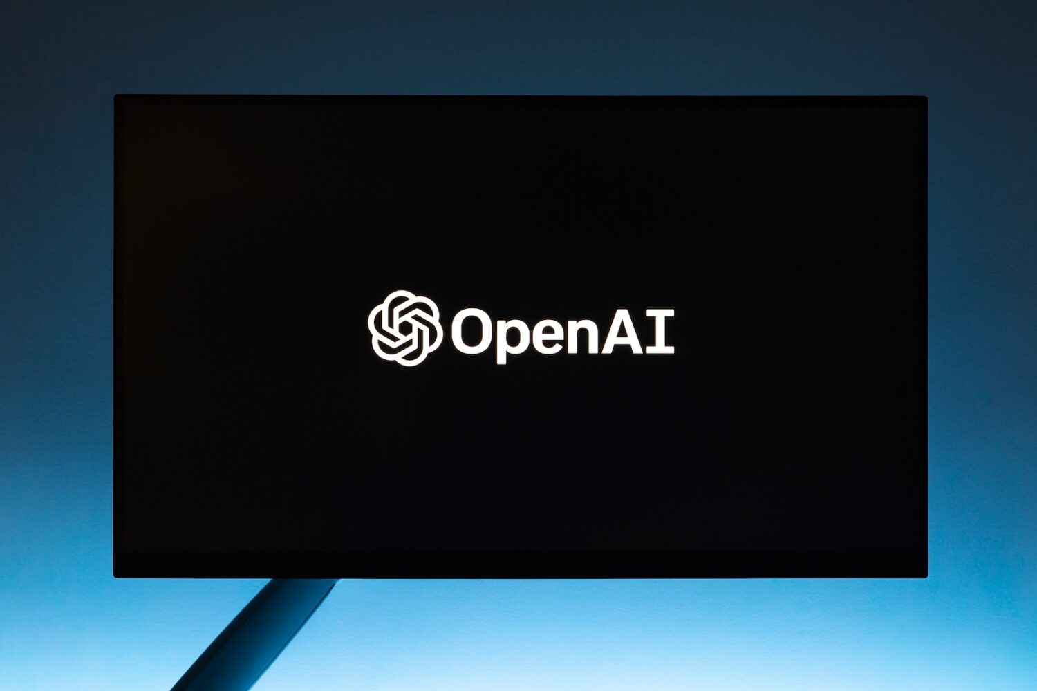 Monitor screen with OpenAI chatgpt logo logo on black background