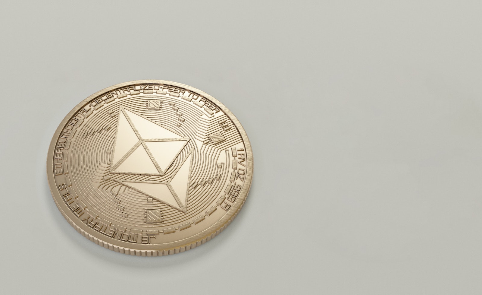 Round Gold-colored Ethereum Coin etoro