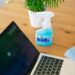 Disinfectant spray near laptop