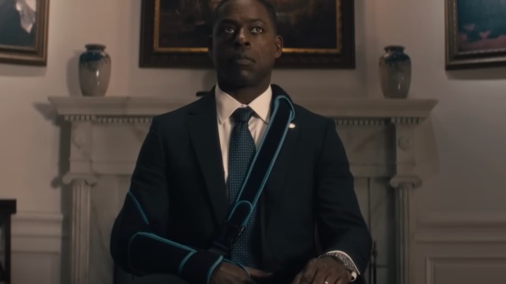 Sterling K. Brown sitting in a chair with a sling.