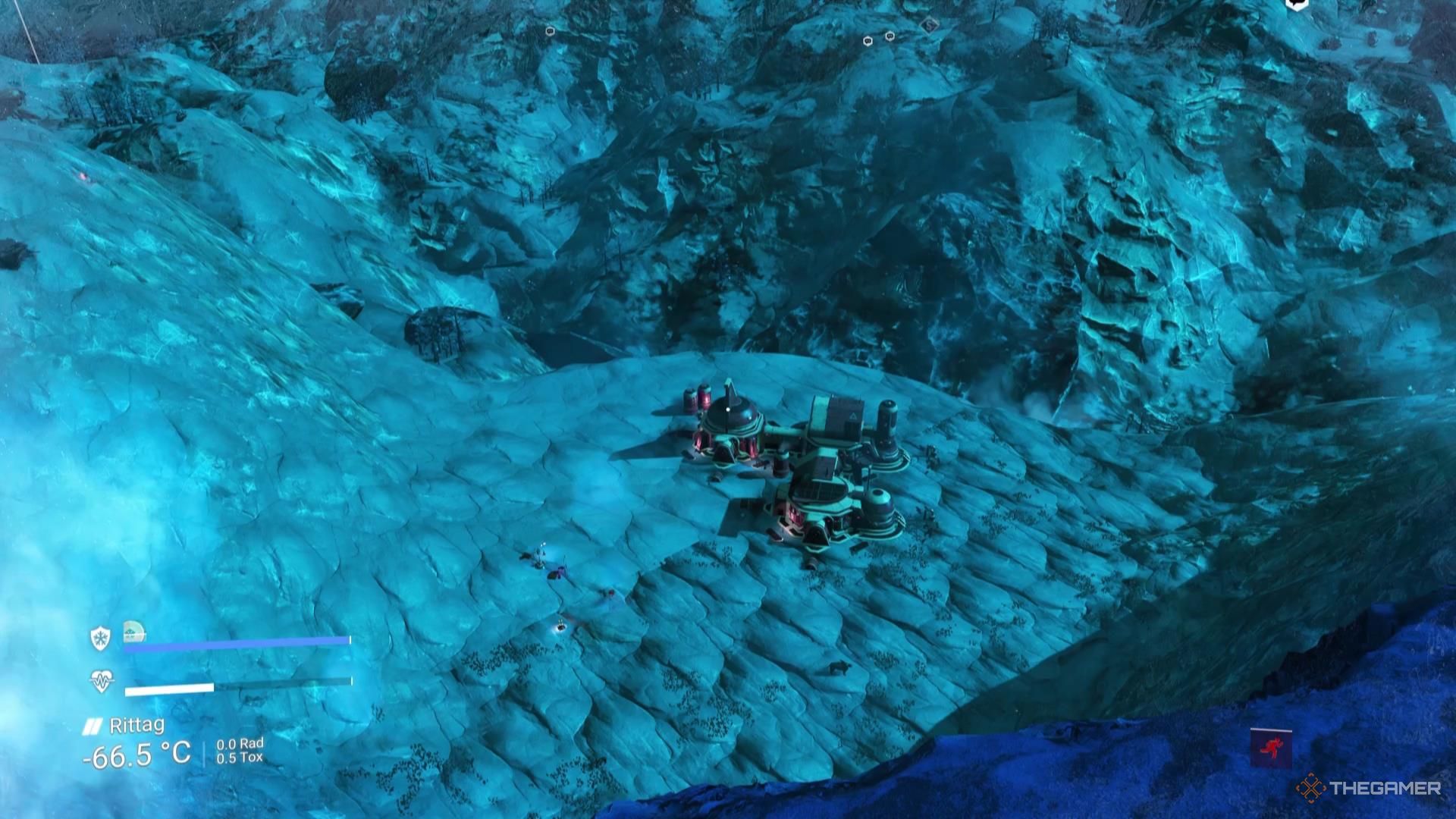 Looking down from a high cliff at a facility in No Man's Sky.