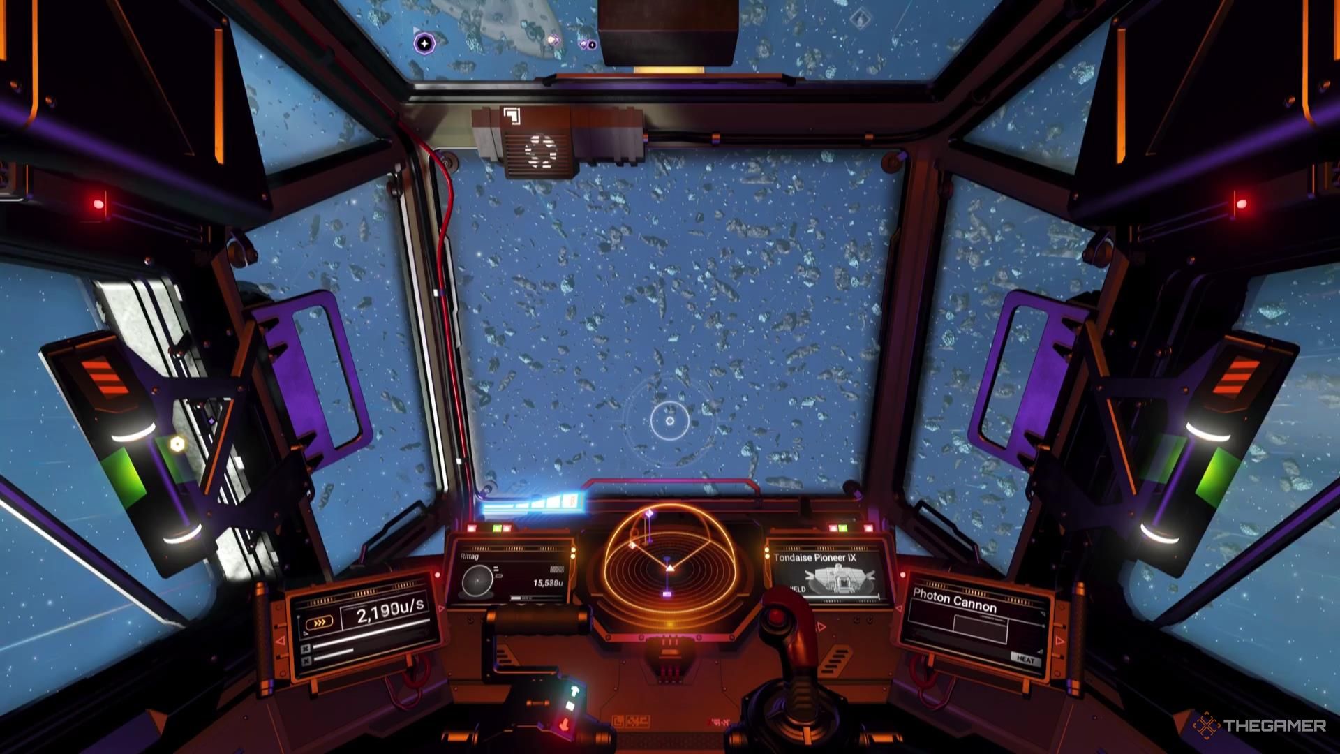 An asteroid field viewed from the cockpit in No Man's Sky.
