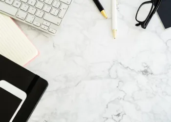 Black Windows key focused among black laptop keyboard