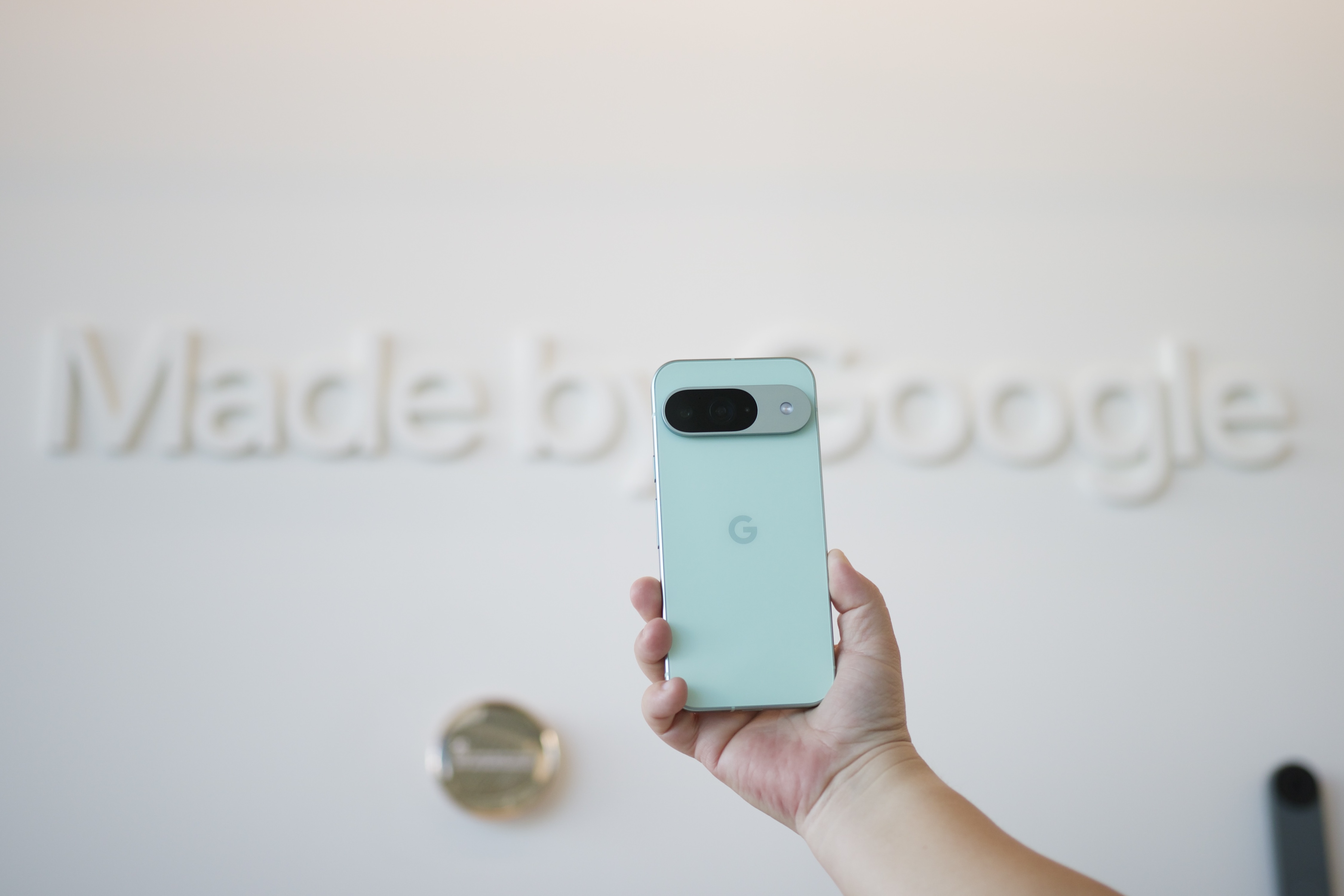 Someone holding the Google Pixel 9.