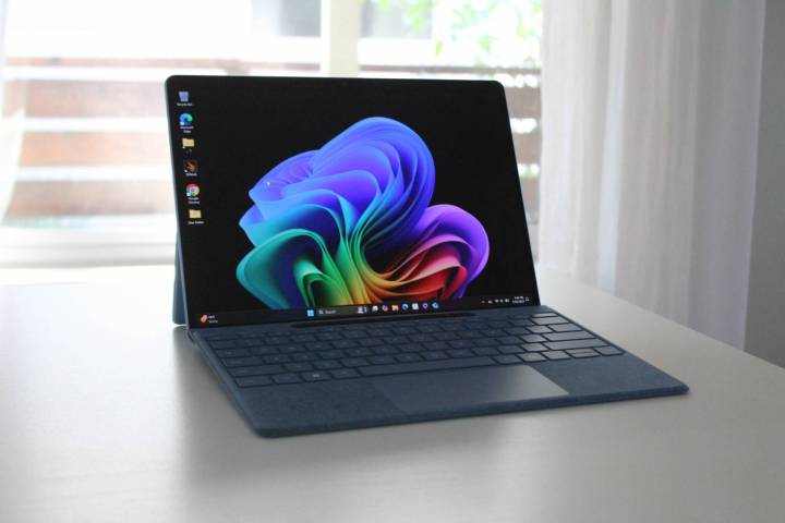 The Surface Pro 11 sitting on a white table in front of a window.