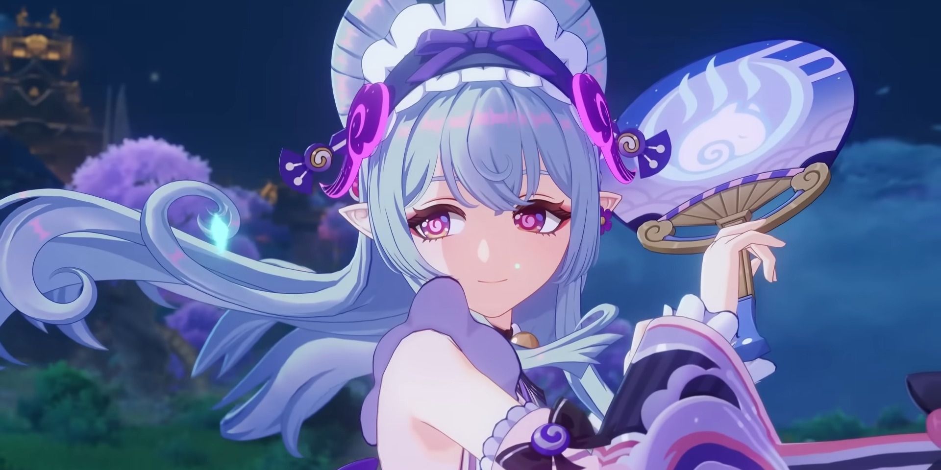 Yumemizuki Mizuki holding a fan beside her face.