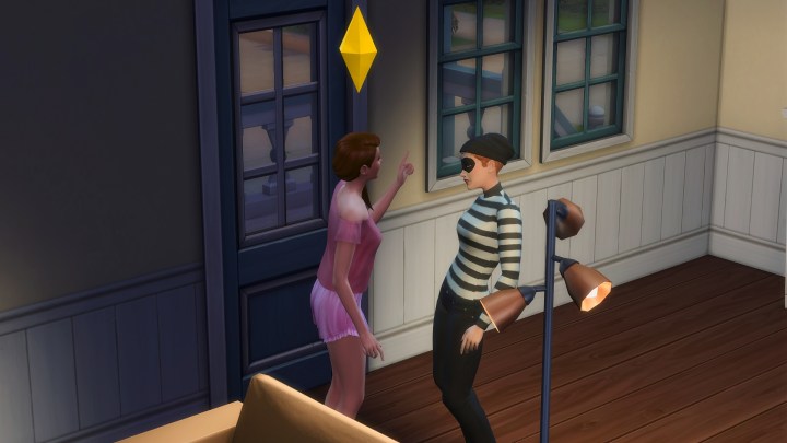 Confronting a burglar in The Sims 4.