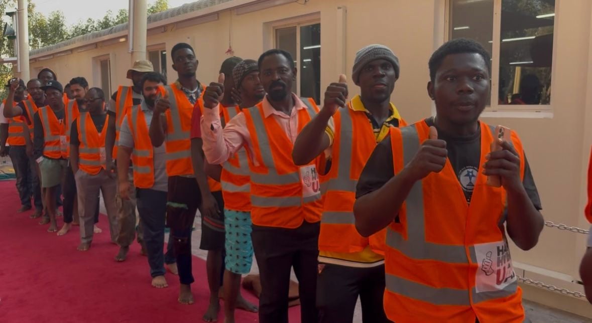 Laborers express their gratitude and hope as they receive Iftar packages at Dubai Industrial City. — Reporter