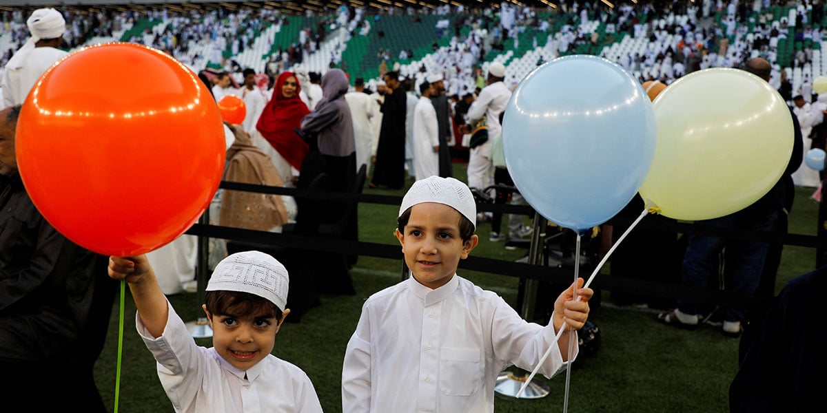 Children holding balloons at the Eid ul-Fitr prayer gathering at Education City Stadium in Al Rayyan, Qatar, March 30, 2025. — Reuters