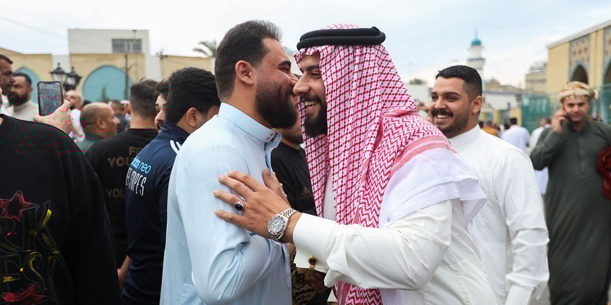 People share Eid greetings on the streets of Baghdad, Iraq, on March 30, 2025. — Reuters