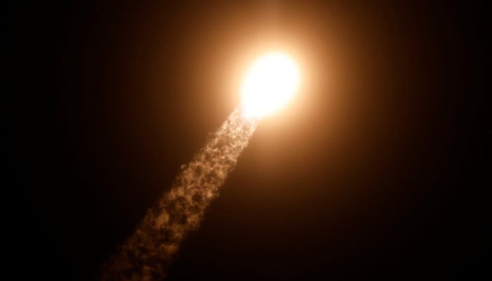 SpaceX Falcon 9 rocket launching into the clouds with four commercial astronauts aboard for the Fram2 mission at Kennedy Space Center in Cape Canaveral, Florida, on March 31, 2025.