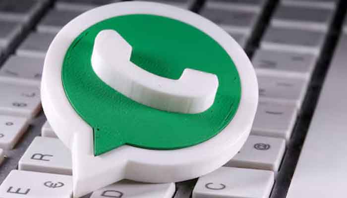 A 3D-printed WhatsApp logo on a keyboard, captured in an illustration on April 12, 2020. — Reuters