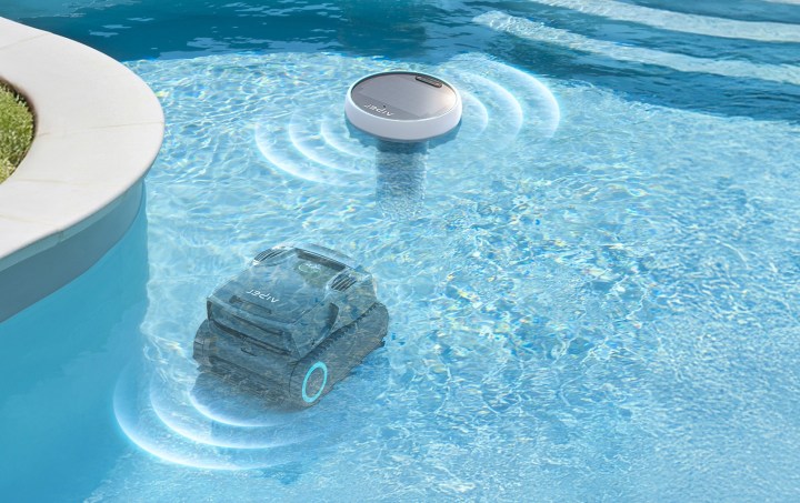 An Aiper HydroComm Pro floating in a pool.