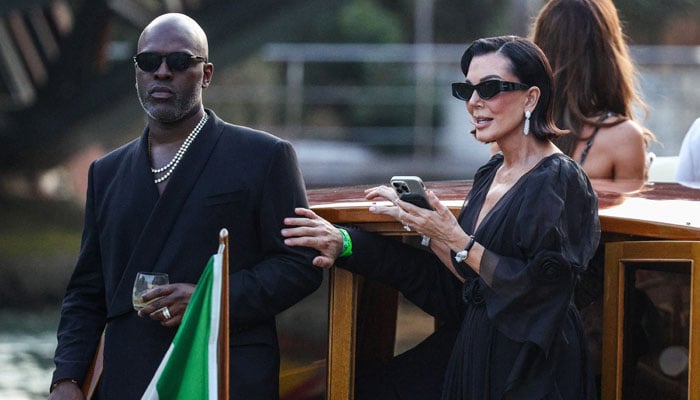 Corey Gamble and Kris Jenner arriving by boat