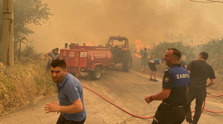 Firefighters and locals tackle a wildfire in Menderes district of Izmir, Turkey, June 29, 2025. — Reuters