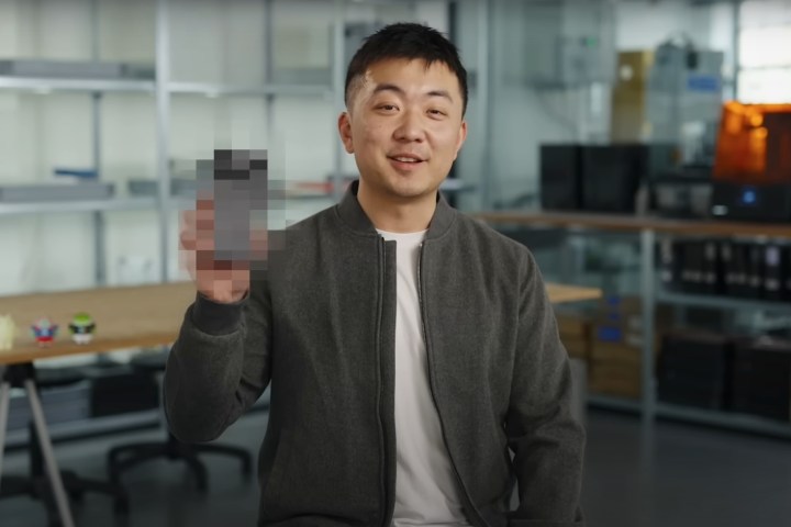 Nothing CEO, Carl Pei holding up a pixelated Phone (3)