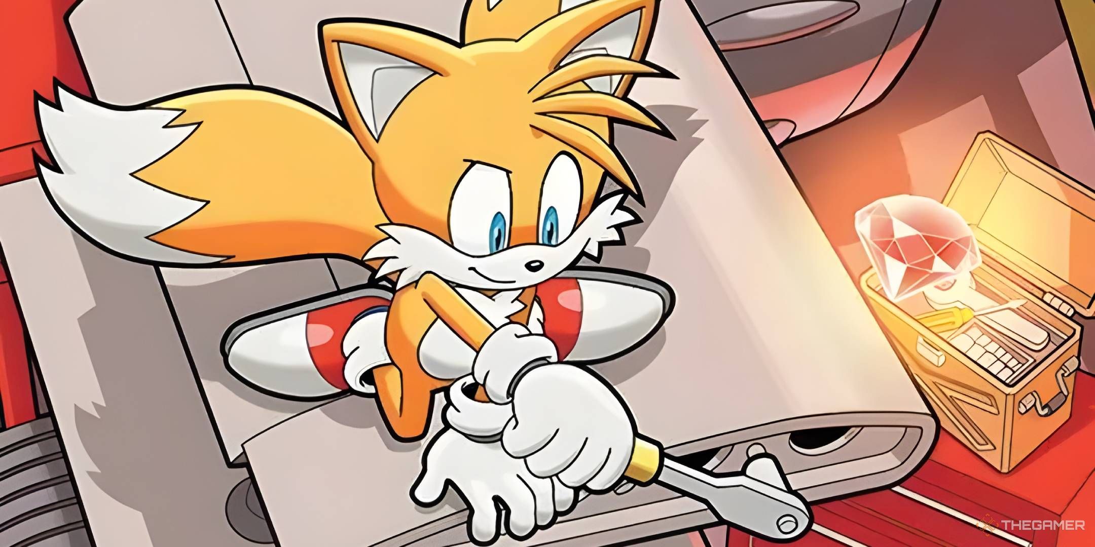 Tails works on his biplane with a Chaos Emerald nearby.