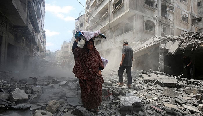 Palestinians inspecting the aftermath of an Israeli strike on a house in Gaza City, August 8, 2025. — Reuters