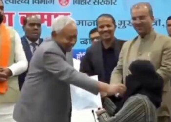 Indian CM controversially pulls down Muslim woman's hijab at event