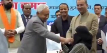 Indian CM controversially pulls down Muslim woman's hijab at event