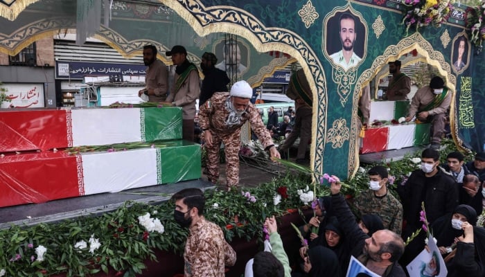 Iranians attend the funerals of security forces personnel killed in recent protests in Tehran on January 14, 2026. — AFP