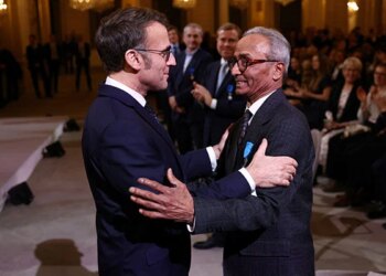 Paris's Last Newspaper Hawker Honored by Macron