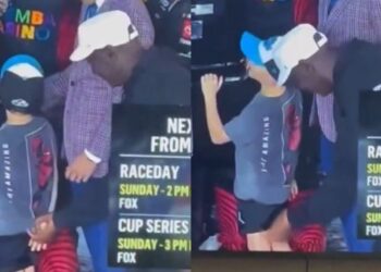 Michael Jordan Tugs Child's Shirt at NASCAR Race