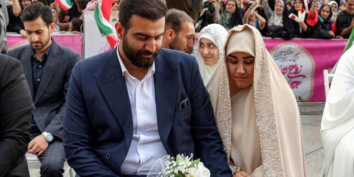 Iran hosts mass weddings for couples prepared for sacrifice